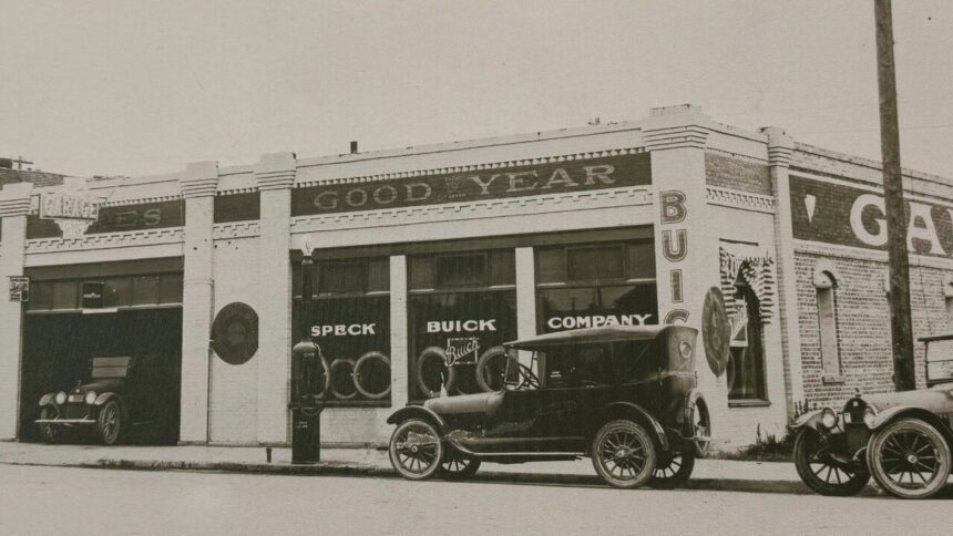 Historic Speck Buick Company dealership with vintage cars parked outside
